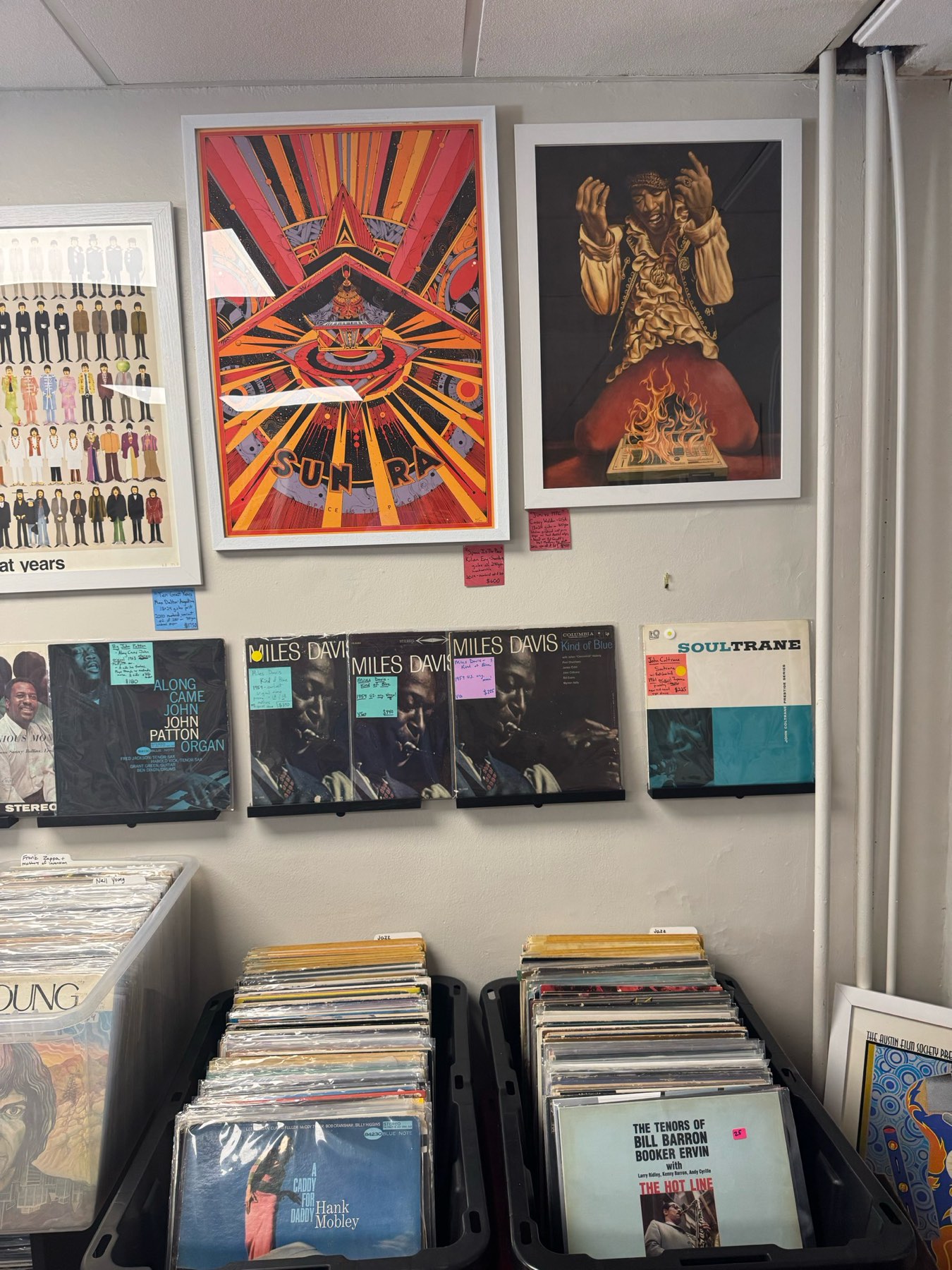 Jazz wall with Kind of Blue, Coltrane, and Blue Note titles under Beatles, Sun Ra, and Hendrix posters