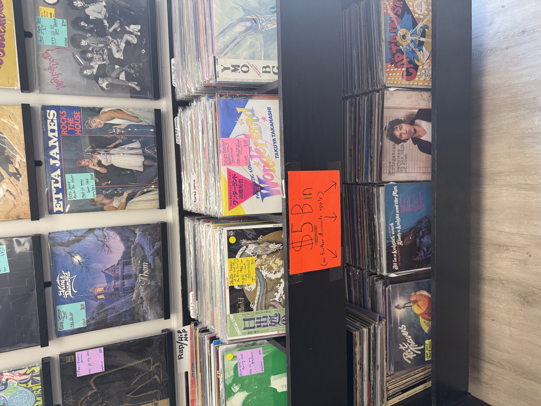 The five-dollar bin under featured wall records