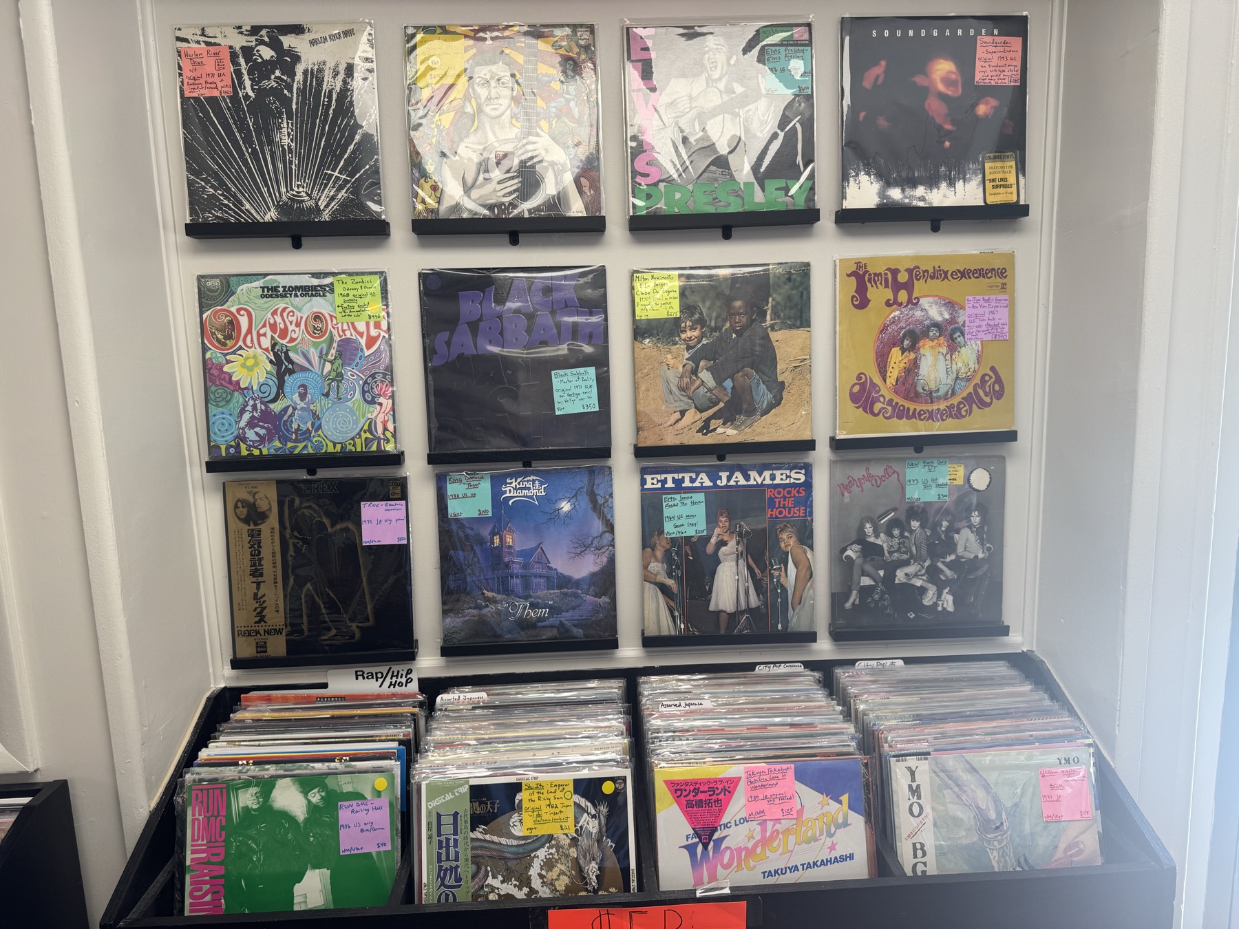 Featured records on the wall, including Howlin’ Wolf, The Zombies, Black Sabbath, and Hendrix